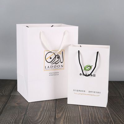 厂家直销购物手提白卡纸礼品袋创意牛皮服装纸袋定制logo